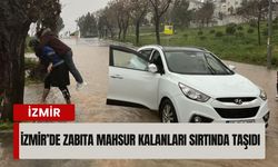 Turuncu alarmda İzmir’de seferberlik: Zabıta mahsur kalanları sırtında taşıdı