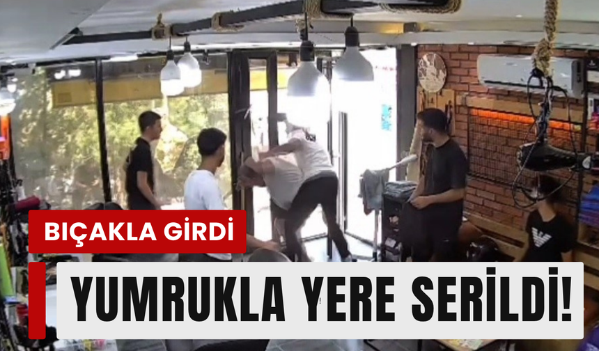 Berbere bıçakla girdi, yumrukla yere serildi!
