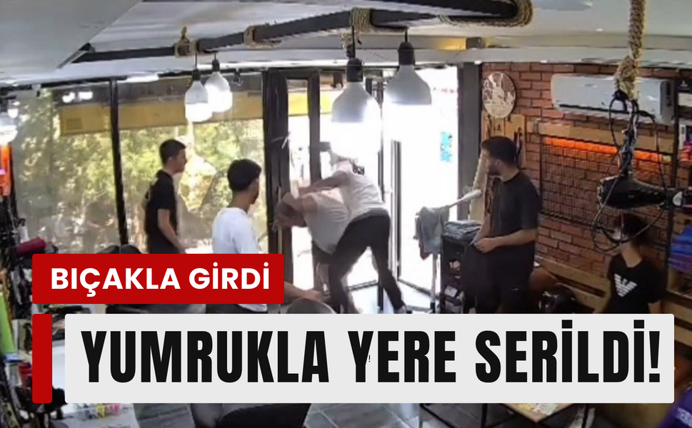 Berbere bıçakla girdi, yumrukla yere serildi!