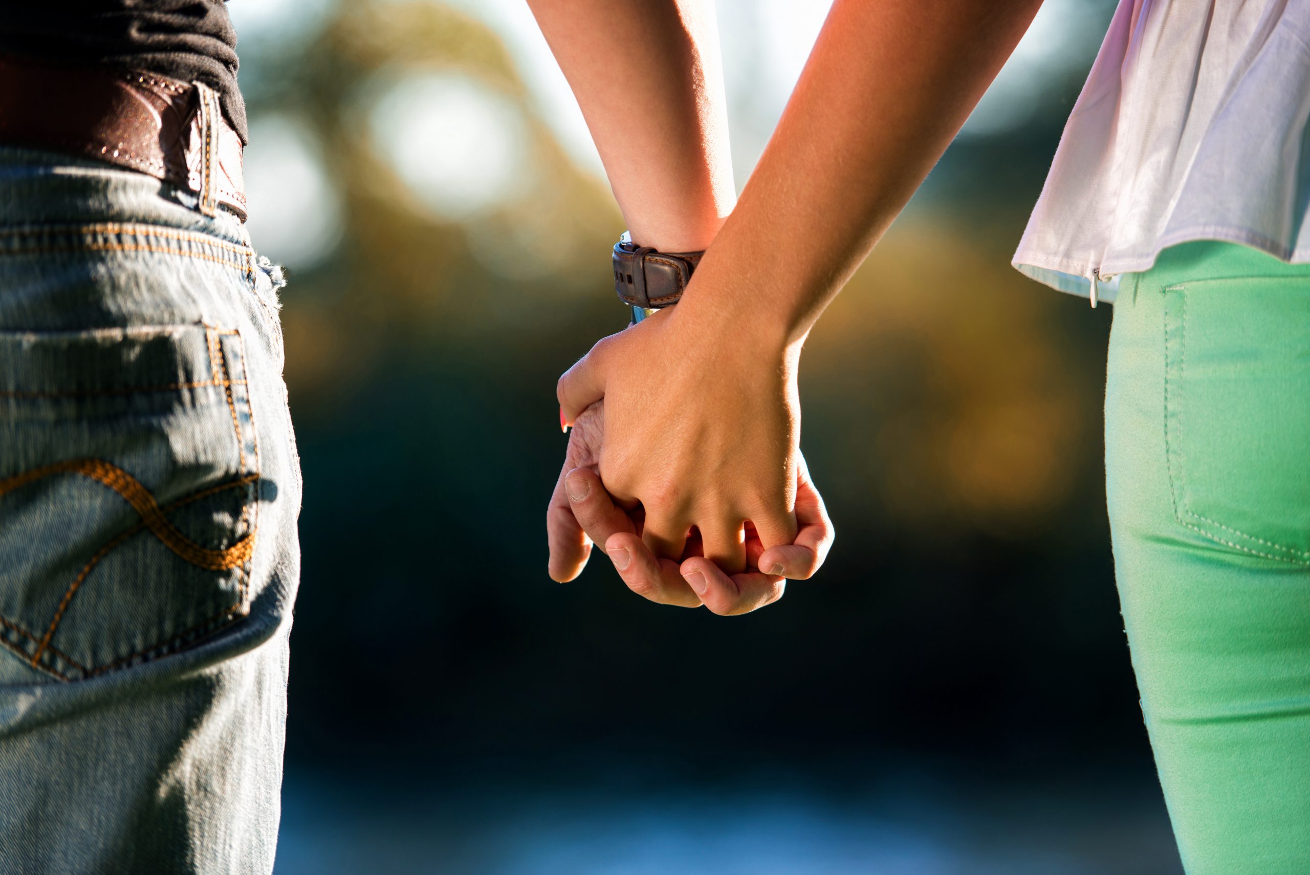 A Couple Holding Hands Scaled